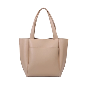 Minimalist beige PU leather tote bag with large capacity and front pocket on white background