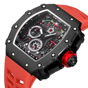 Detailed macro of tonneau case mechanical watch featuring a skeleton dial and red strap
