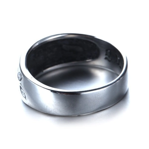 Polished silver wide band ring featuring embossed Evil Eye pattern on white background