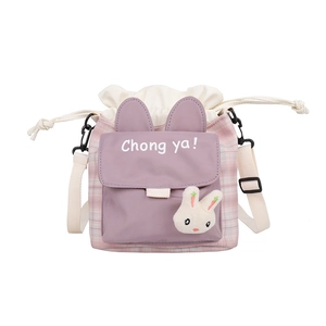 Cute cartoon canvas bucket bag in pink and purple with plush bunny ears and strap
