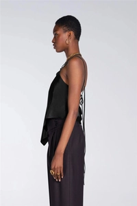 Detail view of the elegant black satin camisole featuring a sexy lace-up back design