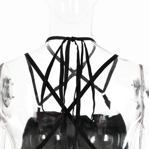 Detail view of backless black satin top with intricate criss-cross lace-up straps on mannequin