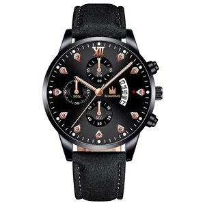 Detail of SHAARMS business watch with rose gold indices and date window display