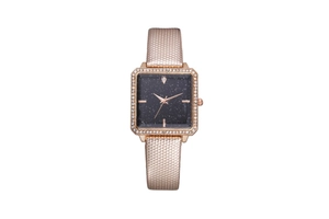Detail of square starry sky watch face with diamond bezel and textured champagne strap