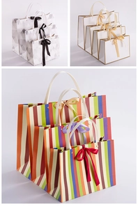 Three premium paper gift bags with geometric, minimalist, and colorful stripe designs