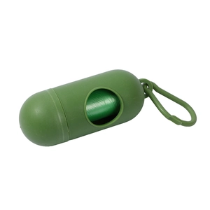 Green pill-shaped dog poop bag dispenser with portable hook and internal waste bag roll