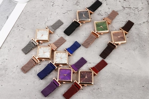 Detailed flat lay of women's square watches with metallic mesh straps in assorted colors