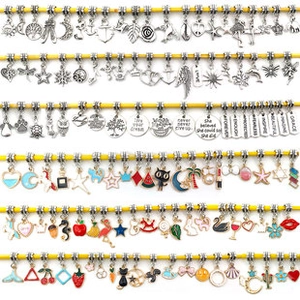 Detailed row of silver DIY resin beads and enamel charms for jewelry bracelets