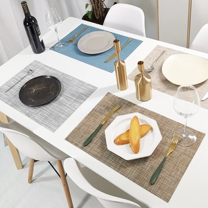 Set of four woven PVC placemats in multiple colors for elegant dining table settings