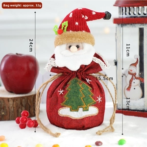 Detail of 3D Santa gift bag with knitted hat, burlap texture and drawstring closure