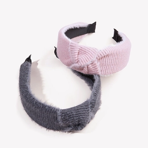 Knitted mohair and corduroy knot headbands in pink and dark grey with plush trim