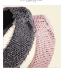 Close-up of soft mohair knitted texture on wide headbands in grey and pink colors