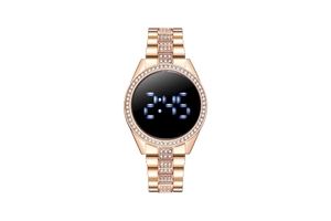 Close-up of rose gold digital watch with blue LED time display and shimmering crystal inlay