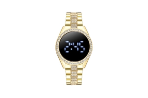 Macro detail of a golden digital watch with luxury rhinestones and sparkling metal band