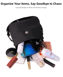 Interior view showing the large storage capacity for cosmetics in the nylon crossbody bag