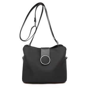 Minimalist black nylon crossbody phone bag with metal ring buckle and adjustable strap