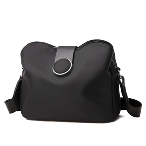 Fashionable black nylon crossbody phone bag with leather flap and adjustable strap