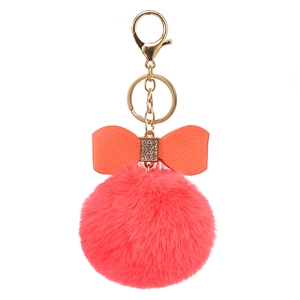 8cm faux rabbit fur pom pom keychain with rhinestone leather bow in coral pink