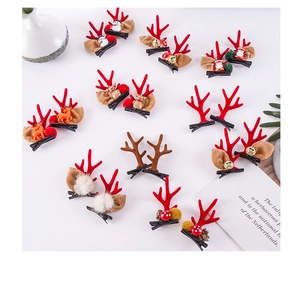 Macro shot of assorted Christmas reindeer antler hair clips with snowmen and bell charms