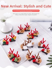 Detailed view of Christmas elk antlers and Santa hair clips on a white grid display