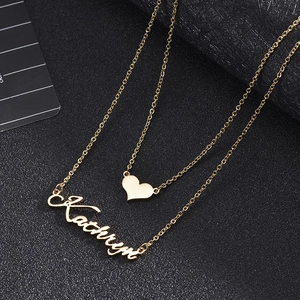 Custom gold layered name necklace with heart pendant and personalized Kathryn charm