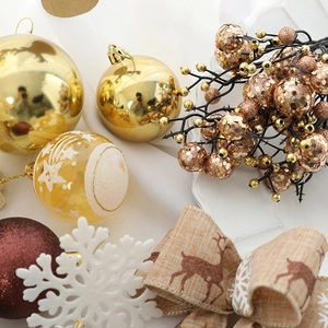 Festive Christmas tree ornaments set with gold balls, glitter berries and reindeer ribbon