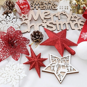 Festive Christmas tree decoration set with red stars, white snowflakes, and wooden ornaments