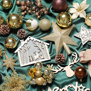 Christmas tree decoration set with gold balls and wooden ornaments on green silk