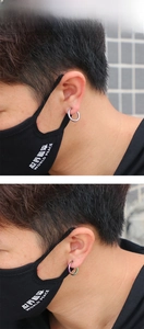 Close-up of titanium steel spring ear clips in silver and rainbow colors on model