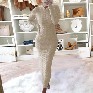 Detail of cable knit texture on a beige slim-fit long sleeve maxi sweater dress