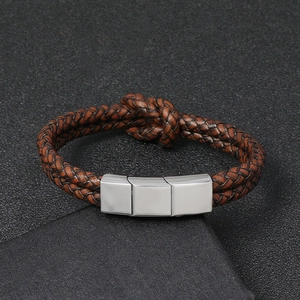 Close-up of brown braided leather bracelet with silver stainless steel magnetic clasp