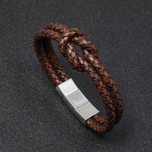 Detail shot of brown braided leather bracelet with high-polish stainless steel magnetic clasp