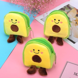 Three avocado shaped plush coin purses with bead chains on a pink and blue background