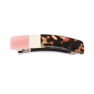 Detail of a rectangular acetate spring clip with pink, cream, and tortoiseshell patchwork