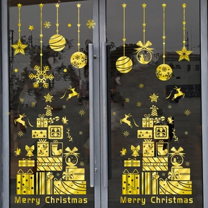 Golden Merry Christmas window stickers featuring stars, snowflakes, reindeer and bells