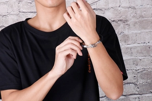 Men's black braided leather bracelet with silver stainless steel fishhook clasp