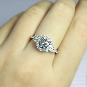 Luxury 2 carat moissanite halo ring with side stone accents in silver finish