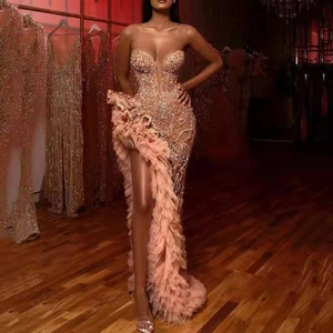 Sparkly sequin tube evening gown with champagne ruffles and a sexy high side slit