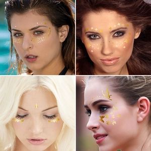 Golden freckle face tattoos with stars and butterflies for party makeup