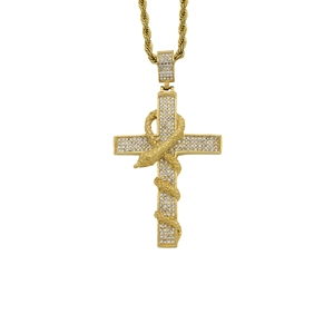 Macro shot of gold Ankh cross pendant with sparkling stones and snake winding
