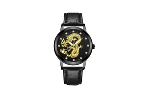 Detail view of the black watch face featuring an intricate golden dragon relief and crystal indices