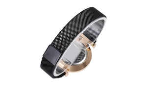 Detail of black mesh stainless steel watch strap and rose gold case on a stand