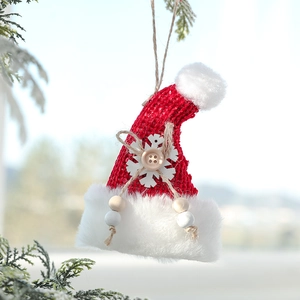 Hanging red knit Christmas hat ornament with plush white trim and snowflake button detail