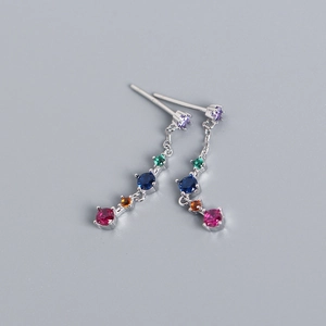 Macro detail of S925 sterling silver long earrings with colorful round zirconia tassels