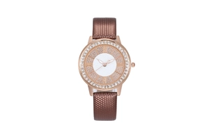 Detail of rose gold quartz watch featuring a rhinestone bezel and brown textured strap