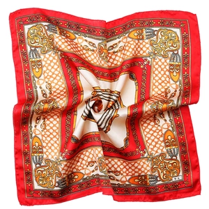 Red square satin scarf featuring vintage gold chain prints and a luxurious silk texture