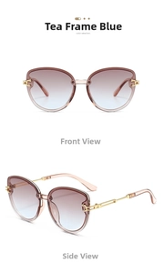 Detail view of cat-eye sunglasses with tea-colored frames and gradient lenses