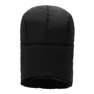 Close-up of windproof black trapper hat featuring thick faux fur lining and quilted texture