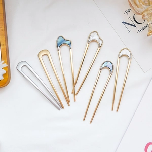 Minimalist metal U-shaped hair pins in gold and silver finish with elegant shell inlay