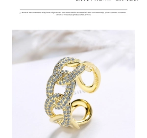Detail of gold chain link ring featuring micro-pave white zircon crystals for women